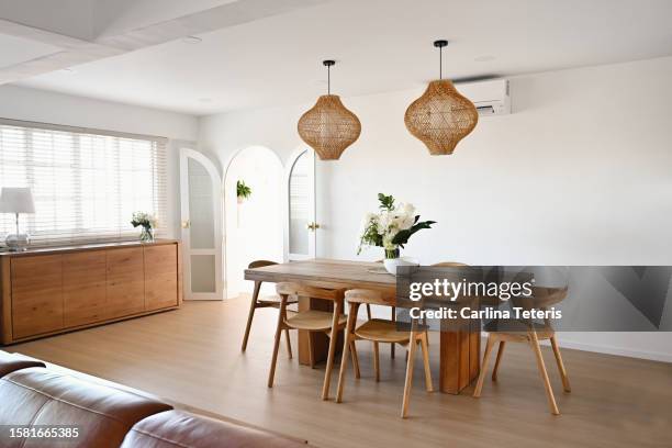 dining room in an open plan apartment - rattan stock pictures, royalty-free photos & images