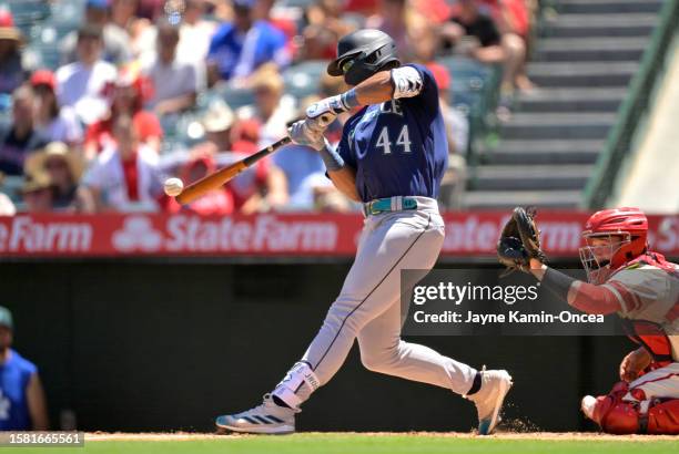 Julio Rodriguez of the Seattle Mariners singles in the third inning against the Los Angeles Angels at Angel Stadium of Anaheim on August 6, 2023 in...