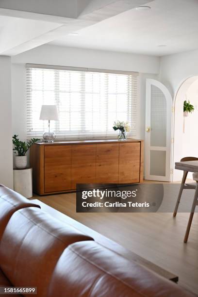 sideboard cabinet in a modern home - anrichte stock-fotos und bilder