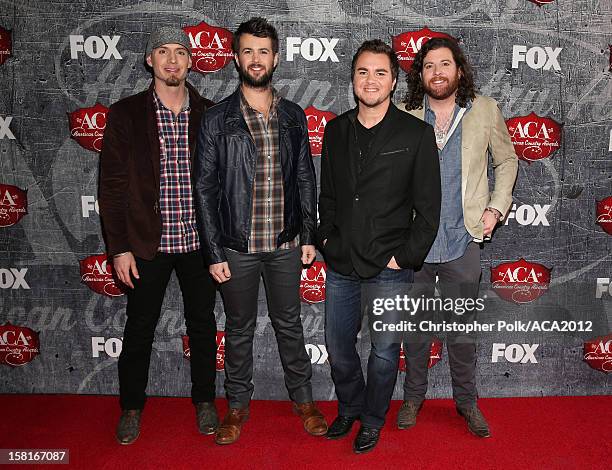 Bassist Jon Jones, drummer Chris Thompson, frontman Mike Eli and guitarist James Young of the Eli Young Band arrive at the 2012 American Country...