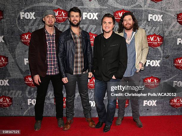 Bassist Jon Jones, drummer Chris Thompson, frontman Mike Eli and guitarist James Young of the Eli Young Band arrive at the 2012 American Country...