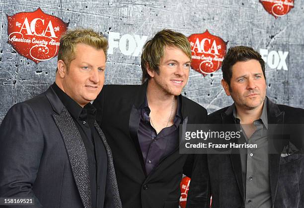 Musicians Gary LeVox, Joe Don Rooney and Jay DeMarcus of Rascal Flatts arrive at the 2012 American Country Awards at the Mandalay Bay Events Center...