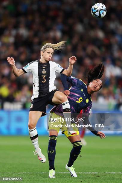 Kathrin Hendrich of Germany and Mayra Ramirez of Colombia jump for the ball during the FIFA Women's World Cup Australia & New Zealand 2023 Group H...