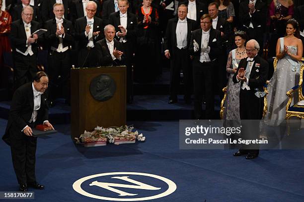 Nobel Prize in Literature laureate, author Mo Yan of China reats after he received his Nobel Prize from King Carl XVI Gustaf of Sweden during the...