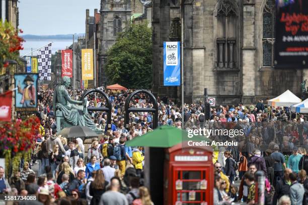 Street entertainers and tourists take to the Royal Mile during the Edinburgh Fringe Festival and Edinburgh International Festival in Edinburgh,...
