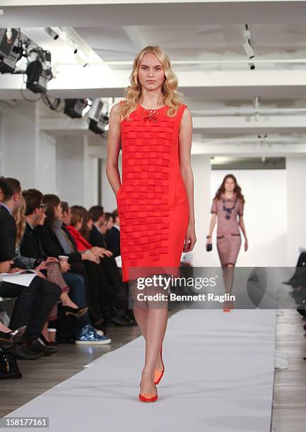 Model wearing Oscar de la Renta walks the runway during the Oscar de la Renta Pre-Fall 2013 Collection on December 10, 2012 in New York City.