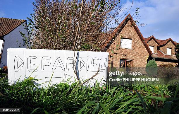 Picture taken on December 10, 2012 shows a sign reading ''Depardieu'' set up in front of a house in the Belgian village of Nechin, where France's...