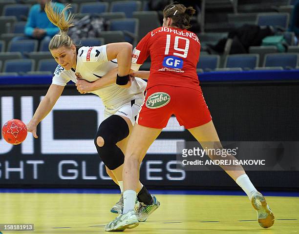 Czech's Helena Sterbova vies with Denmark's Line Jorgensen during their Women's EHF Euro 2012 Handball Championship match Czech Republic vs Denmark...