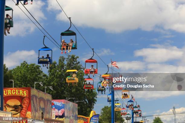 state fair with amusement park rides and attractions - amusement park ohio stock pictures, royalty-free photos & images
