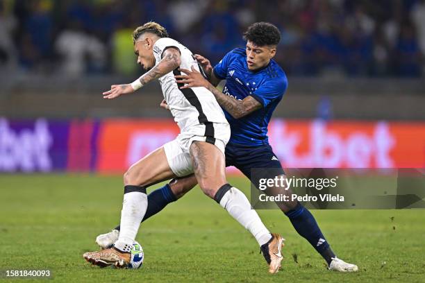 Felipe Machado of Cruzeiro and Tiquinho Soares of Botafogo fight for the ball during a match between Cruzeiro and Botafogo as part of Brasileirao...