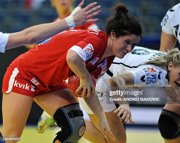 Denmark's Mette Gravholt vies with Czech's Helena Sterbova during their Women's EHF Euro 2012 Handball Championship match Czech Republic vs Denmark...