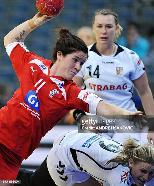 Denmark's Mette Gravholt vies with Czech's Helena Sterbova during their Women's EHF Euro 2012 Handball Championship match Czech Republic vs Denmark...
