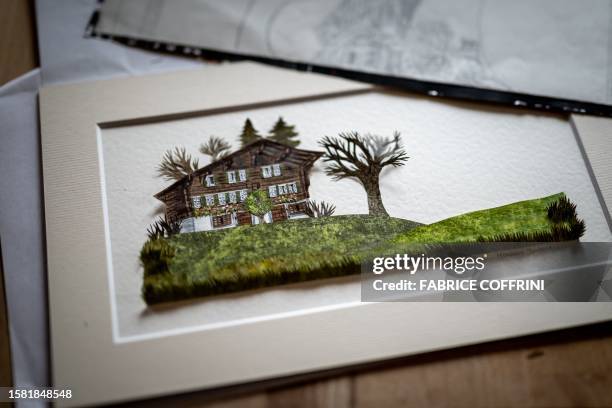 This photograph taken on July 25 shows a work by Swiss paper cutting artist Marianne Dubuis at her home, in Chateau d'Oex, in the Prealps in western...