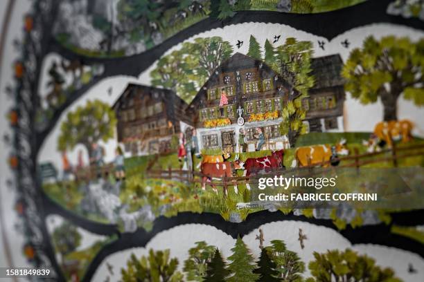 This photograph taken on July 25 shows a detail of a work by Swiss paper cutting artist Marianne Dubuis at the Swiss Centre of Paper Cut in Chateau...