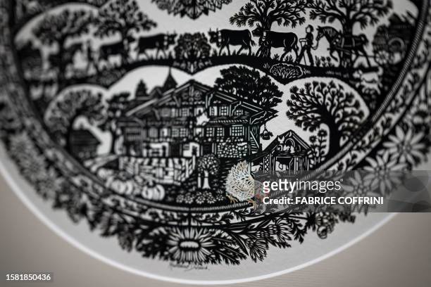 This photograph taken on July 25 shows a detail of a work by Swiss paper cutting artist Marianne Dubuis at the Swiss Centre of Paper Cut in Chateau...