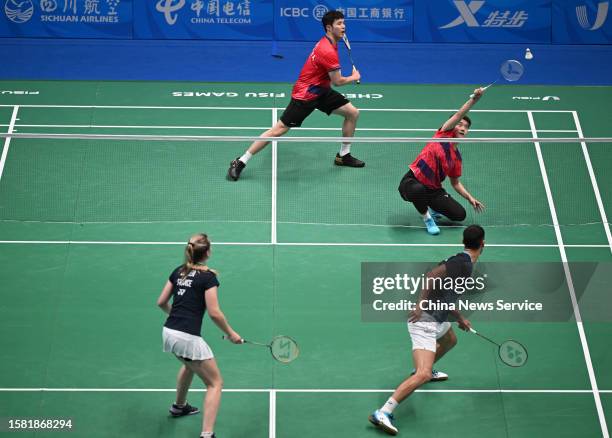 He Jiting and Du Yue of Team China compete during the Mixed Doubles match in Mixed Team Group A against Team France on Day 2 of 31st FISU Summer...