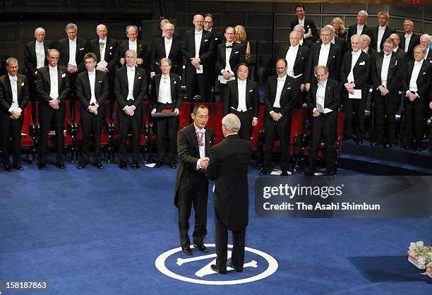 Nobel Prize in Medicine laureate Shinya Yamanaka receives the Nobel Prize from King Carl XVI Gustaf of Sweden during the Nobel Prize Award Ceremony...