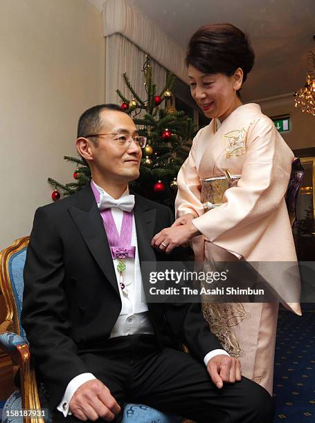 Chika Yamanaka , wife of Nobel Prize in Medicine laureate Shinya Yamanaka arranges her hudsband's bow tie ahead of the Nobel Prize Award Ceremony on...