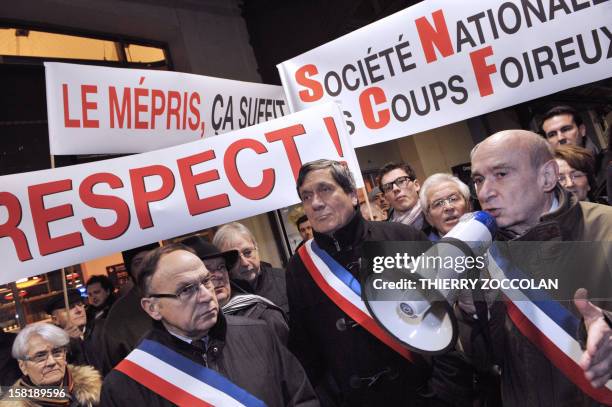 The mayor of Vichy, Claude Malhuret speaks beside other local elected officials as he takes part in a demonstration to block a train commuting from...