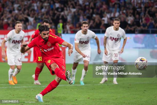 Andrea Compagno scores a goal from the penalty kick during the SuperLiga Round 4 match between FCSB and CFR Cluj at Stadionul Steaua on August 06,...