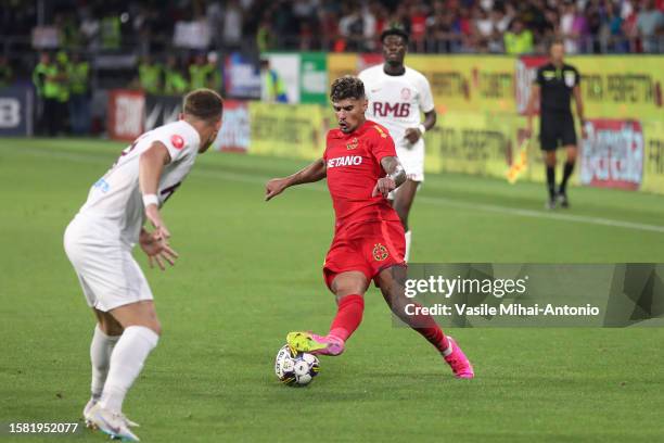 Florinel Coman of FCSB is seen in action during the SuperLiga Round 4 match between FCSB and CFR Cluj at Stadionul Steaua on August 06, 2023 in...