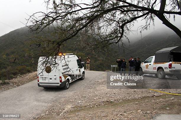 Forensic Medical Service staff move the remains of singer Jenni Rivera who died on December 09, 2012 in a plane crash near the ranch on Tejocote, in...