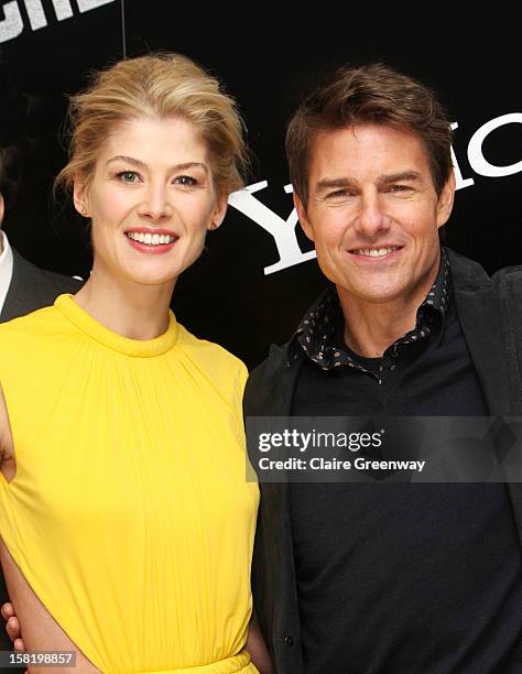Actors Rosamund Pike and Tom Cruise attend the world premiere of "Jack Reacher" at The Odeon Leicester Square on December 10, 2012 in London, England.