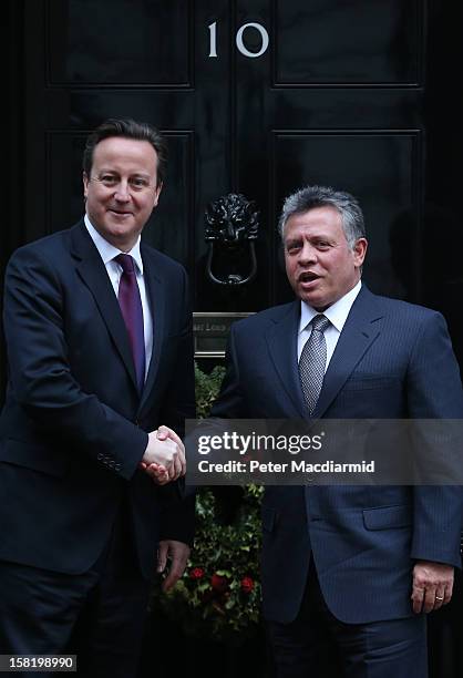 King Abdullah II of Jordan shakes hands with Prime Minister David Cameron outside 10 Downing Street on December 11, 2012 in London, England. King...