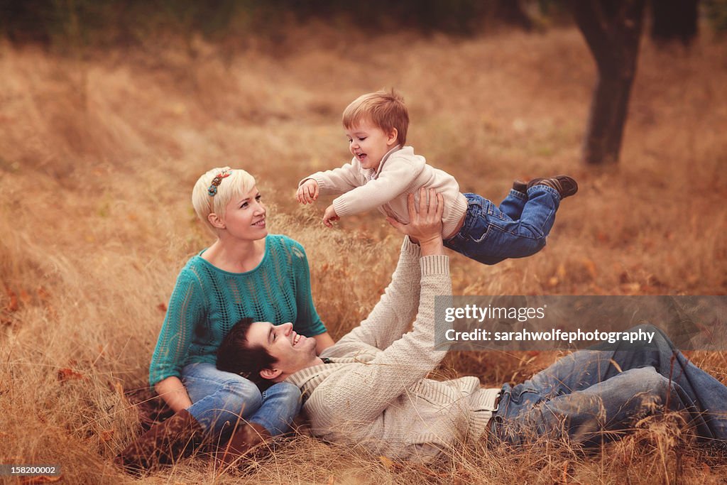 Family of three playing together