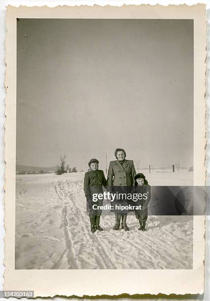 Vintage photo of mother and children outdoor in winter