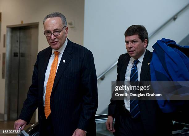 Dec 11 : Sen. Charles Schumer, D-NY., and Mark Begich, D-Ak., walk through the Senate subway on thier way to the U.S. Capitol on December 11, 2012.