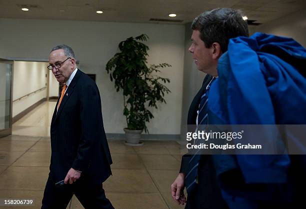 Dec 11 : Sen. Charles Schumer, D-NY., and Mark Begich, D-Ak., walk through the Senate subway on thier way to the U.S. Capitol on December 11, 2012.