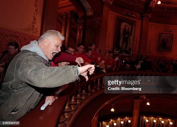 Demonstrators crowd in to the rotunda inside the Capitol building in Lansing, Michigan, U.S., on Tuesday, Dec. 11, 2012. Chanting labor supporters...