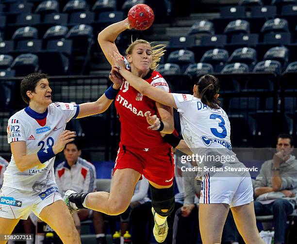 Helena Sterbova of Czech republic is challenged by Blandine Dancette and Raphaelle Tervel of France during the Women's European Handball Championship...