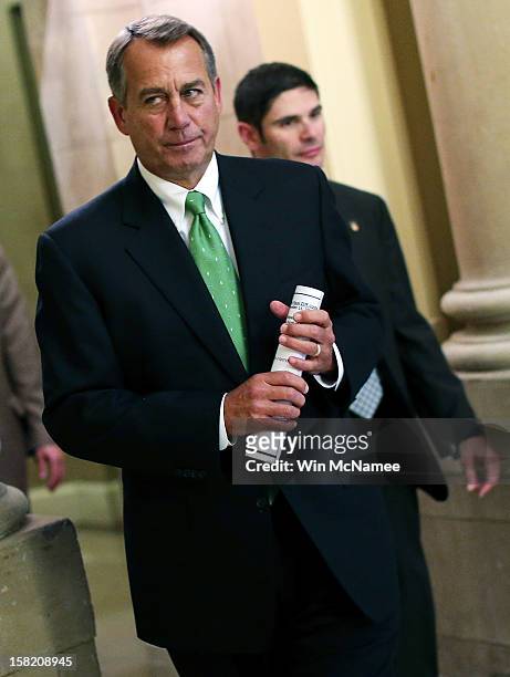 Speaker of the House John Boehner walks to the House chamber to speak on the pending "fiscal cliff" negotiations December 11, 2012 in Washington, DC....