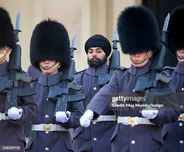 Sikh Guardsman Jatenderpal Singh Bhullar , a soldier in the Scots Guards, forms up with his fellow soldiers on the parade ground of Wellington...