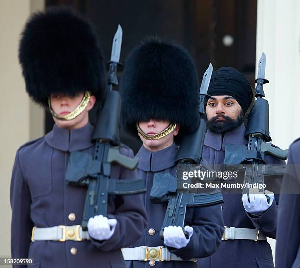 Sikh Guardsman Jatenderpal Singh Bhullar , a soldier in the Scots Guards, forms up with his fellow soldiers on the parade ground of Wellington...