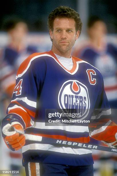 Craig MacTavish of the Edmonton Oilers looks on before a hockey game against the Washington Capitals on February 15, 1994 at USAir Arena in Landover,...