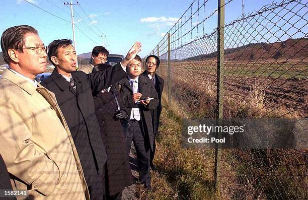 South Korean chief delegate Lee Byung-woong and his North Korean counterpart Rhee Kum Chul visit the venue of the reunion center after holding...