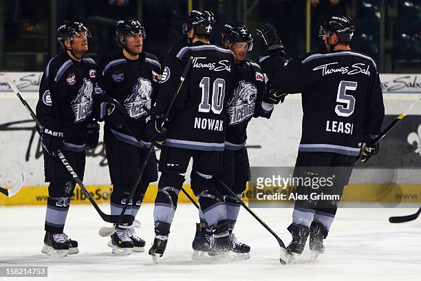 Yan Stastny of Ice Tigers celebrates his team's first goal with team mates during the DEL match between Thomas Sabo Ice Tigers and Straubing Tigers...