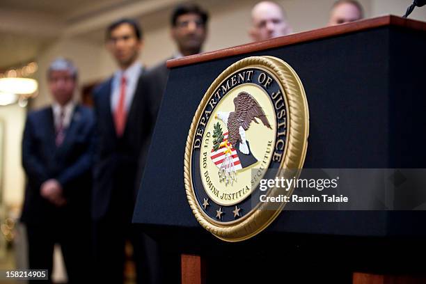 Department of Justice seal is displayed on a podium during a news conference to announce money laundering charges against HSBC on December 11, 2012...