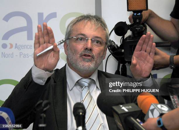 Daniel Lenoir, the Regional Health Agency director, gestures as he speaks during a press conference on June 16, 2011 in Lille, northern France, after...