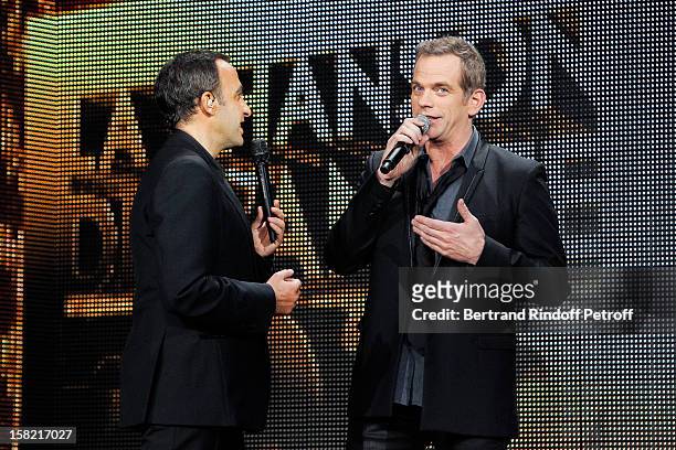 Singer Garou and TV host Nikos Aliagas attend 'La Chanson De L'Annee 2012' Show Recording at Palais des Sports on December 10, 2012 in Paris, France.
