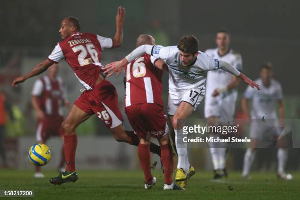 Will Evans of Hereford United loses out to Russ Penn and Chris Zebroski of Cheltenham Town during the FA Cup with Budweiser Second Round Replay match...