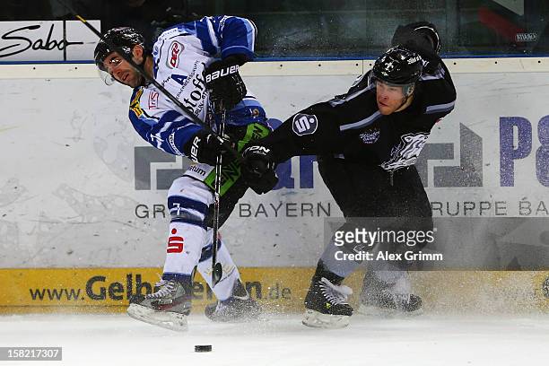 Laurent Meunier of Straubing is challenged by Yan Stastny of Ice Tigers during the DEL match between Thomas Sabo Ice Tigers and Straubing Tigers at...