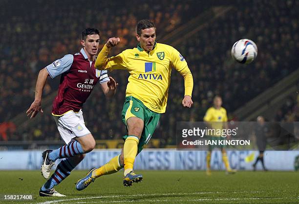 Norwich City's Welsh striker Steve Morison scores his team's first goal against Aston Villa during their English League Cup quarter final football...