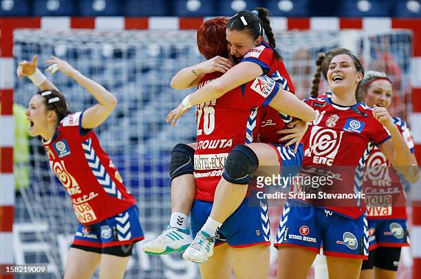 Jelena Popovic and Biljana Filipovic of Serbia celebrate victory against Denmark after the Women's European Handball Championship 2012 Group I main...