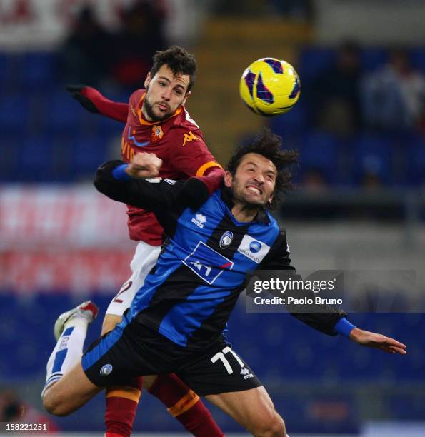 Mattia Destro of AS Roma competes for the ball with Cristian Raimondi of Atalanta BC during the TIM Cup match between AS Roma and Atalanta BC at...