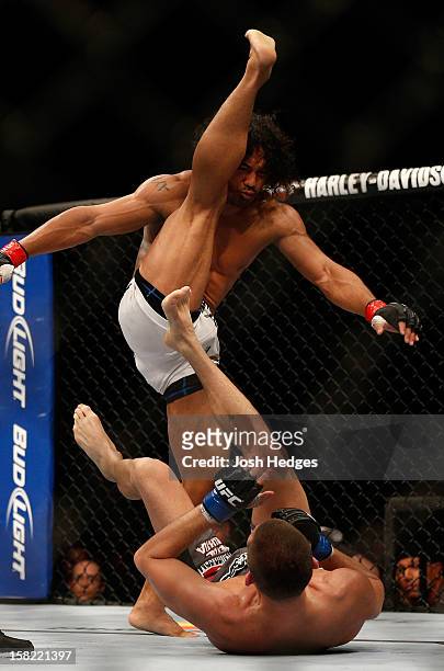 Benson Henderson delivers a kick against Nate Diaz during their lightweight championship bout at the UFC on FOX event on December 8, 2012 at Key...