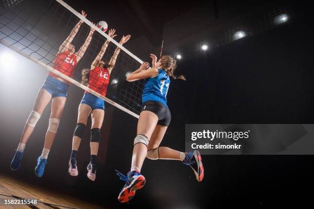 women defending volleyball - spiking stock pictures, royalty-free photos & images